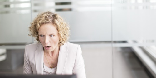 Worried Employee In Front of Computer