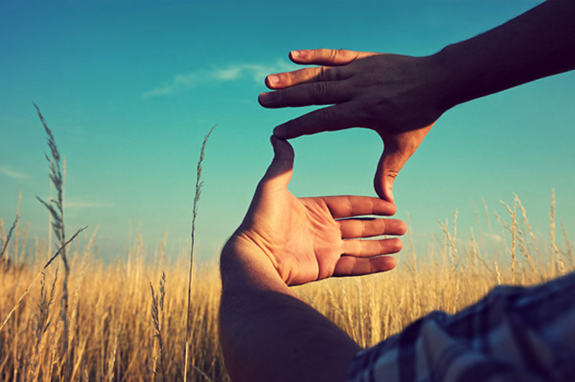 Framing a landscape with hands